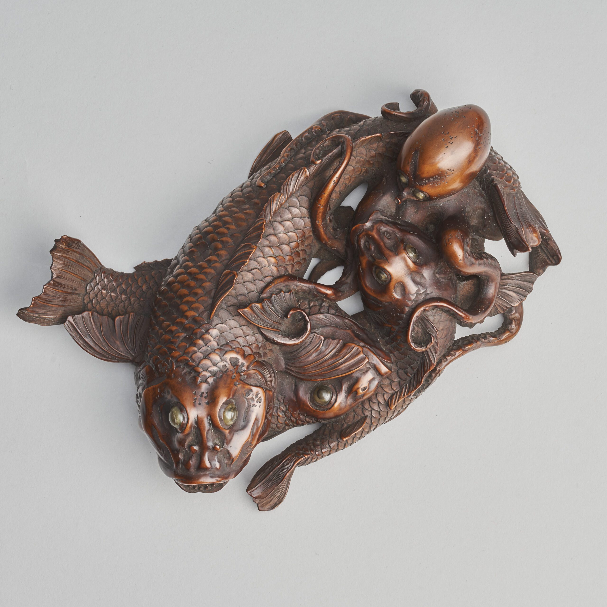 A masterful Japanese wood carving of a pile of sea creatures